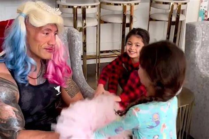 
Dwayne Johnson’s 2 Young Daughters Give Him a Festive Holiday Makeover: ‘Dwanta Needs a Tutu’ 